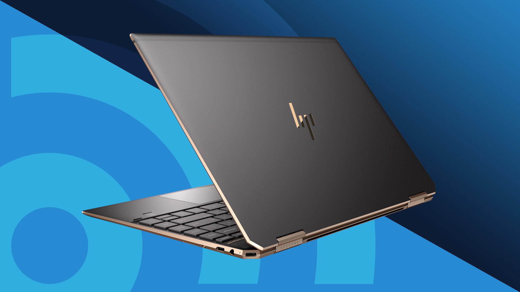 Sleek HP Spectre laptop with a dark metallic finish and gold accents, positioned against a blue gradient background.